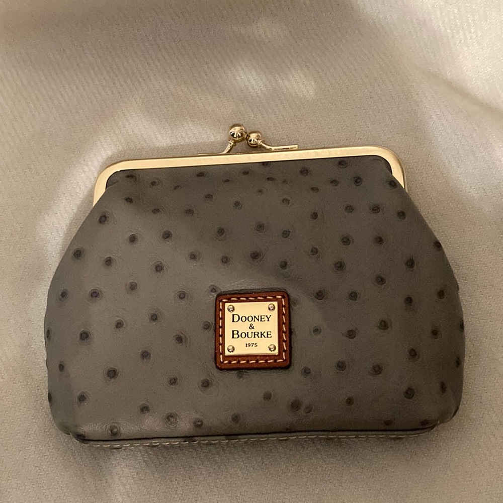 New with tags and duster bag Dooney and Bourke grey/tag coin purse.